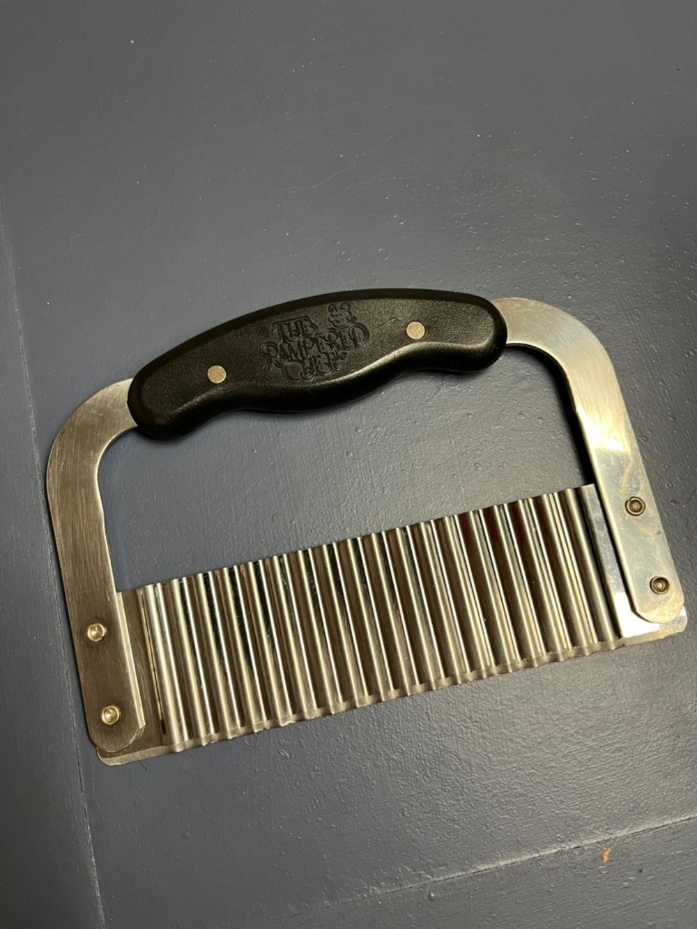 The Pampered Chef Crinkle Cutter with Black Handle and Stainless Blade